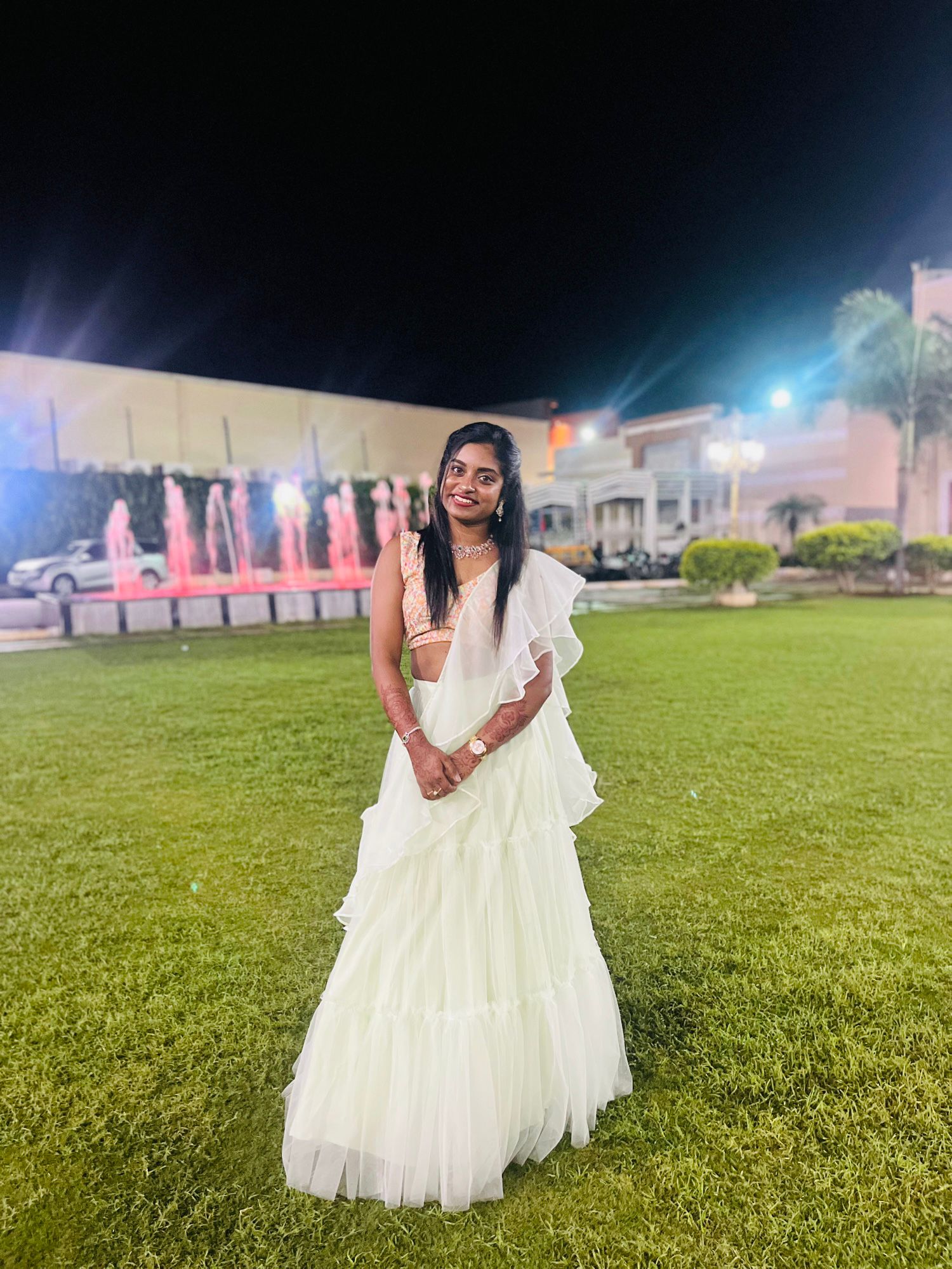 Ivory ruffle saree paired with a delicately patterned blouse