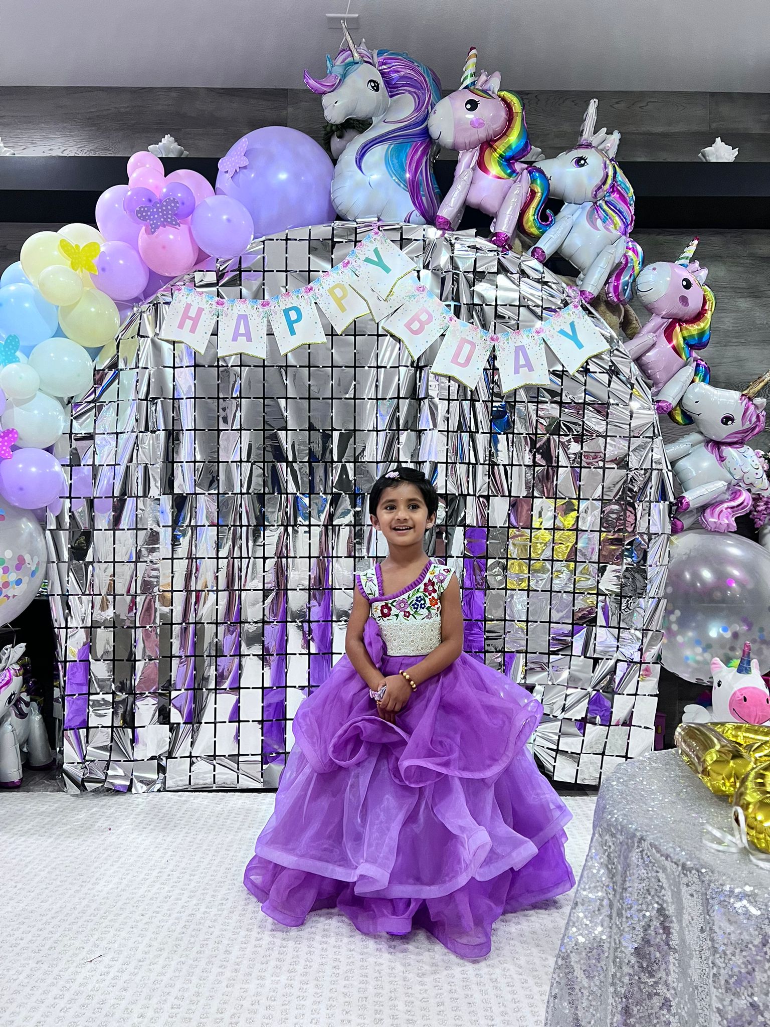 Violet layered ruffle gown with an embroidered bodice