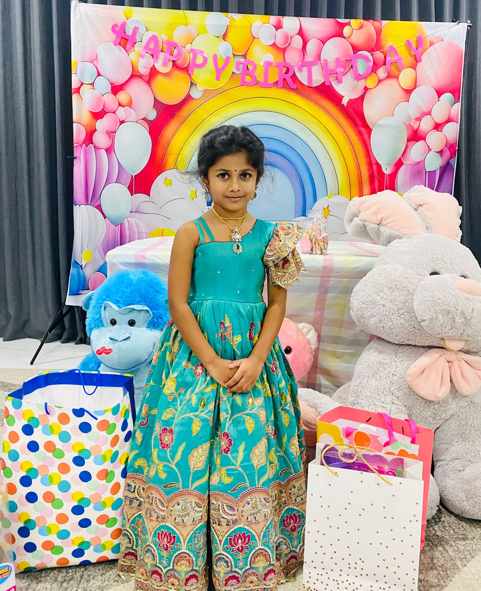 Teal full-length girls gown with Kalamkari-inspired borders