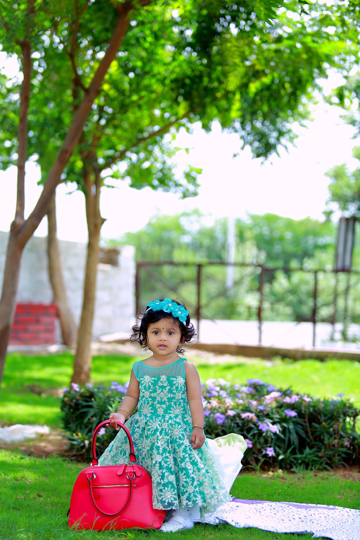 Aqua lace girls dress with a flowing ivory back detail